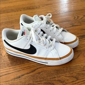Nike Court Legacy White Low-Top Sneakers with Black Swoosh and Gold Accent